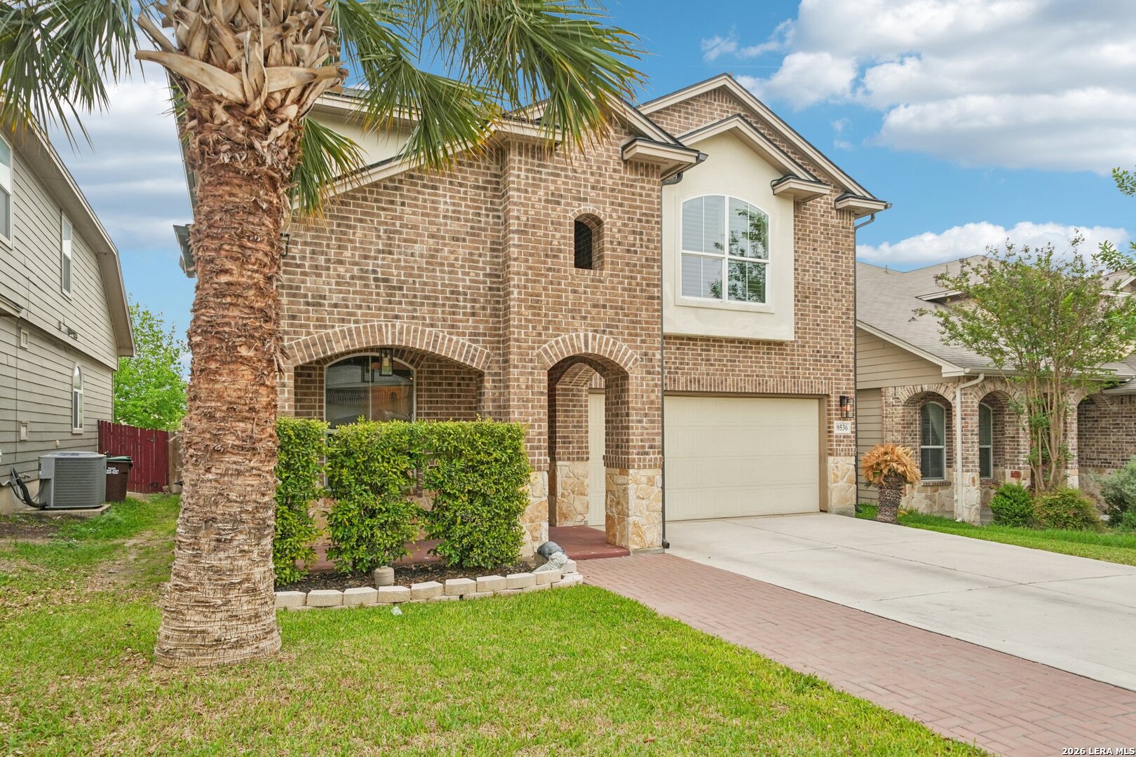 9536 Gold Stage Road San Antonio, TX 78254 - Photo 3 of 39 a front view of a house with a garden and yard