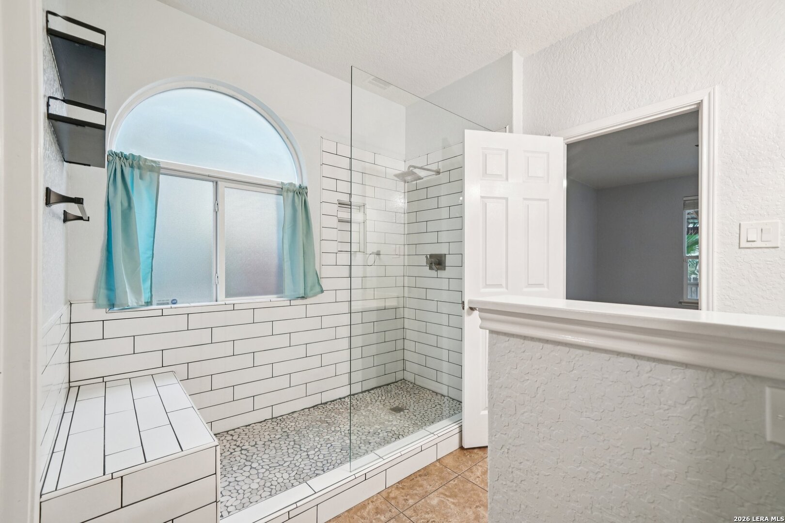 9536 Gold Stage Road San Antonio, TX 78254 - Photo 33 of 39 a bathroom with a bathtub and a shower