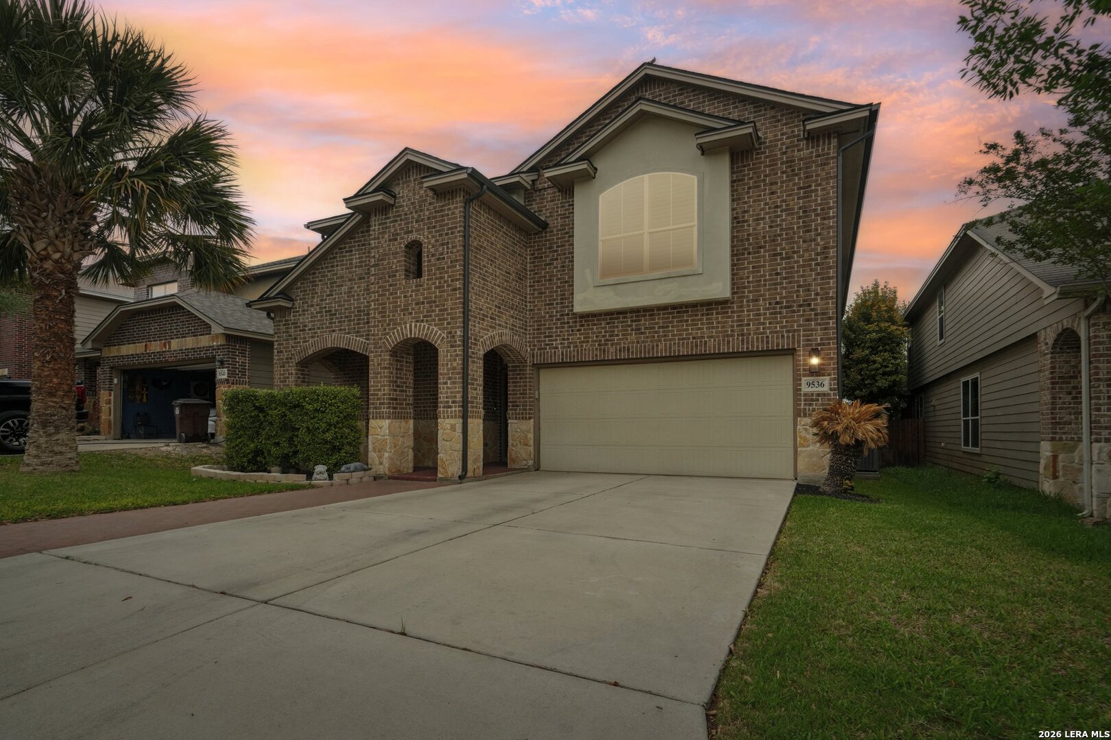 9536 Gold Stage Road San Antonio, TX 78254 - Photo 38 of 39 a front view of a house with a yard and garage