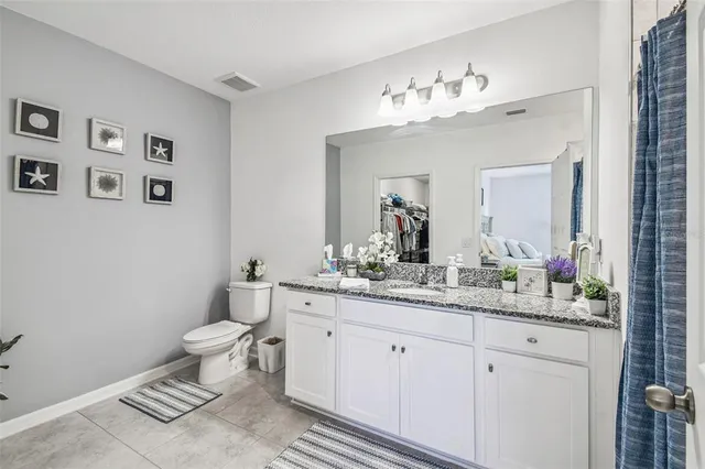 an aerial view of residential houses with outdoor space and swimming pool