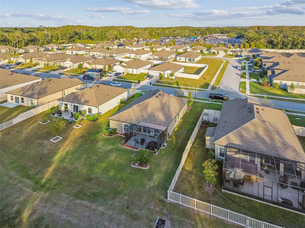 12907 Conquistador Loop Spring Hill, FL 34610 - Photo 69 of 74 an aerial view of residential houses with outdoor space
