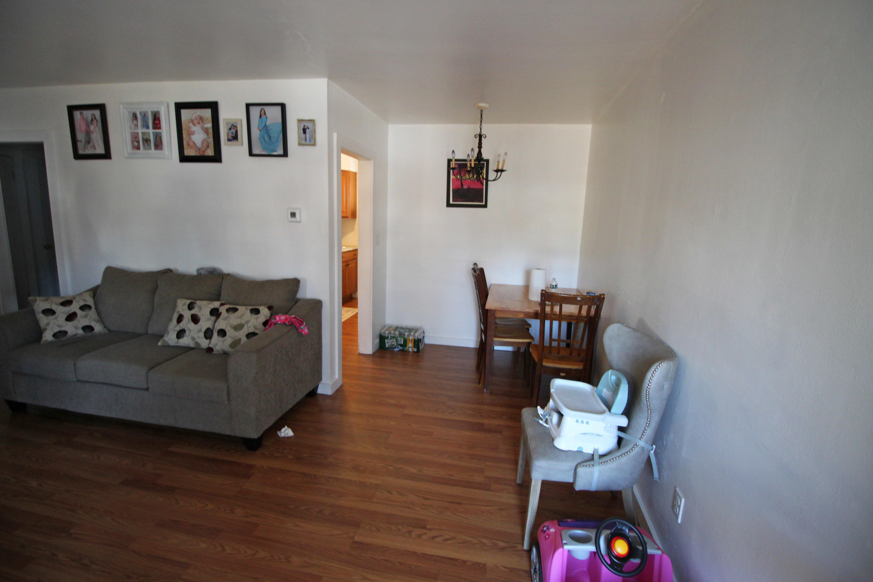 30 Fresh Holes Road, Unit 30 & 32 Hyannis, MA 02601 - Photo 3 of 27 a living room with furniture and wooden floor