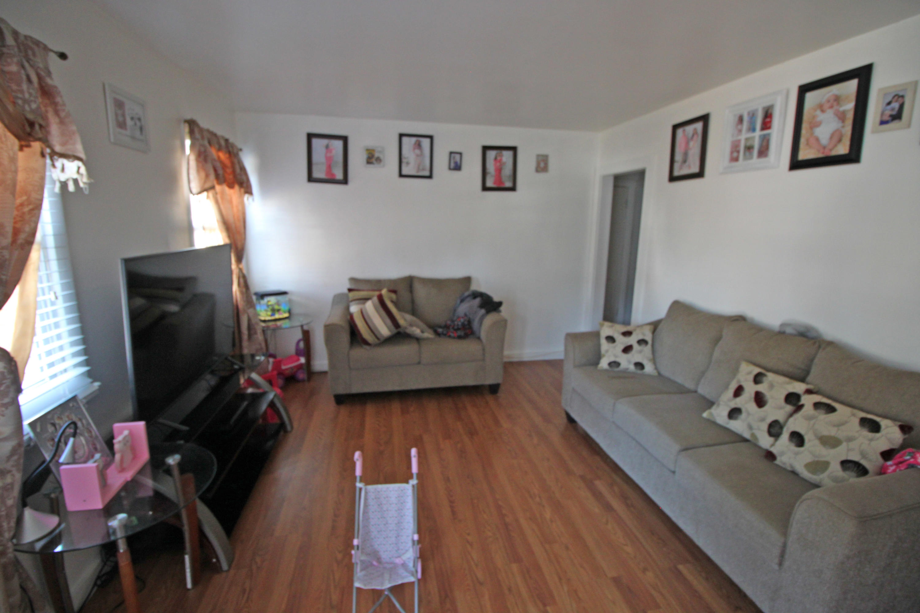 30 Fresh Holes Road, Unit 30 & 32 Hyannis, MA 02601 - Photo 4 of 27 a living room with furniture and a flat screen tv