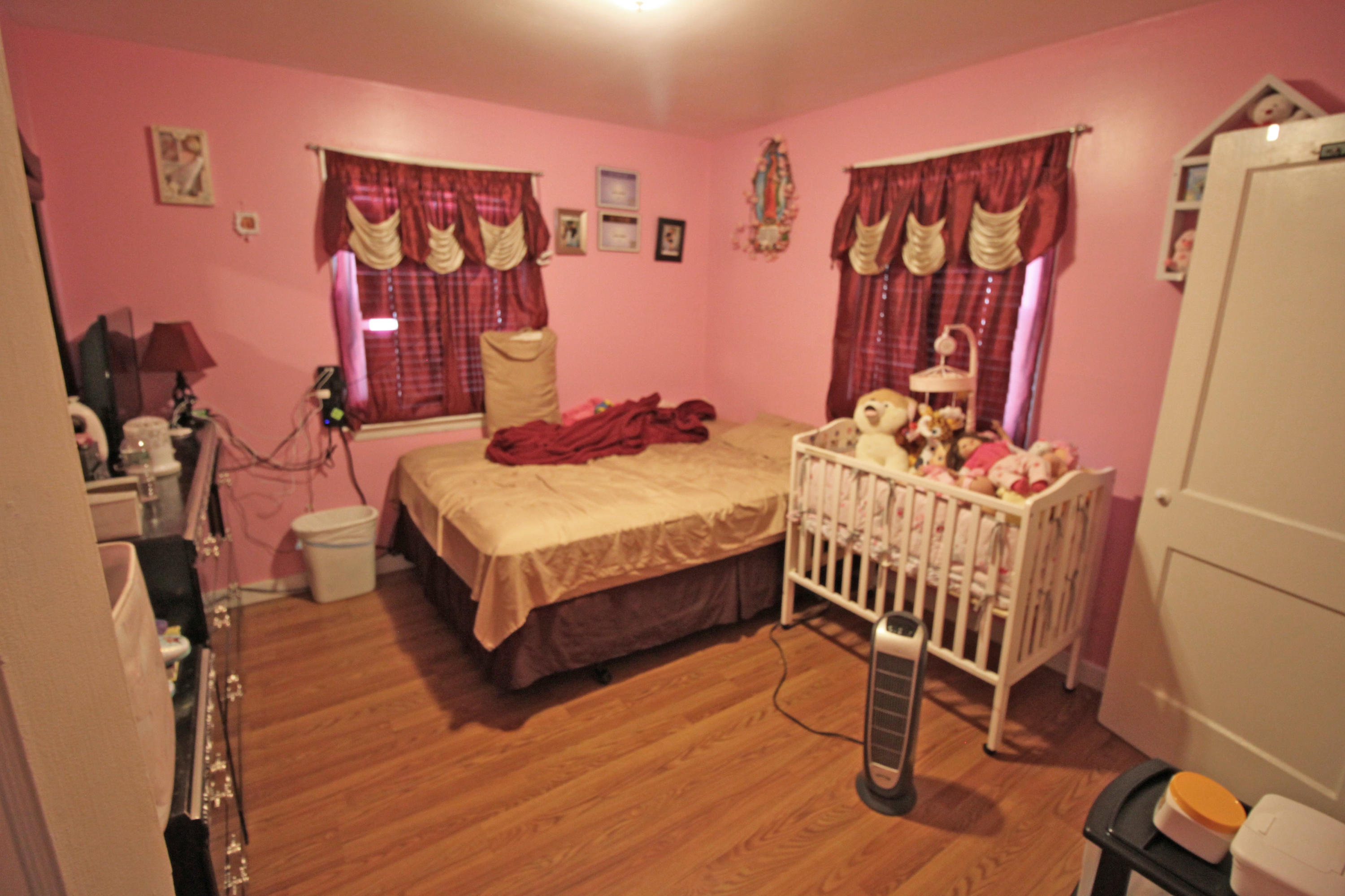 30 Fresh Holes Road, Unit 30 & 32 Hyannis, MA 02601 - Photo 9 of 27 a bedroom with furniture and a wooden floor