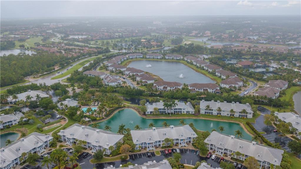 7870 Mahogany Run Lane, Unit 1713 Naples, FL 34113 - Photo 14 of 15 an aerial view of a city with lake view