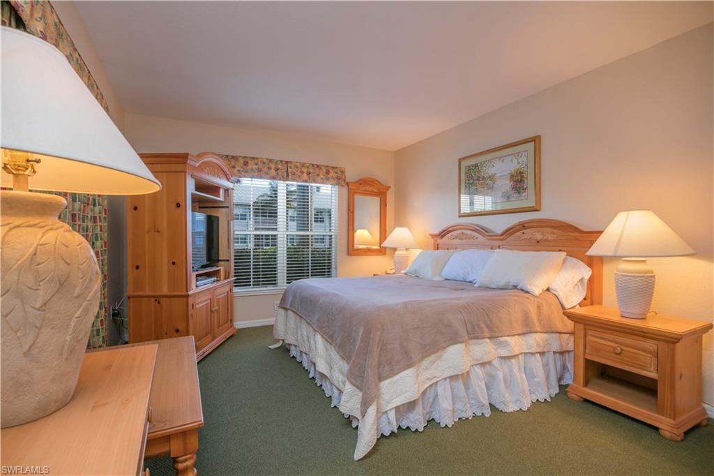 7870 Mahogany Run Lane, Unit 1713 Naples, FL 34113 - Photo 4 of 15 a bedroom with a bed and a window
