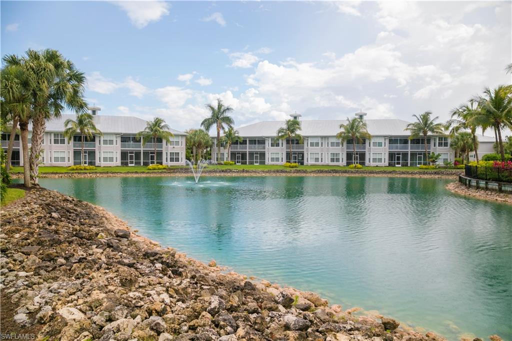 7870 Mahogany Run Lane, Unit 1713 Naples, FL 34113 - Photo 9 of 15 a view of a lake with building in front of it