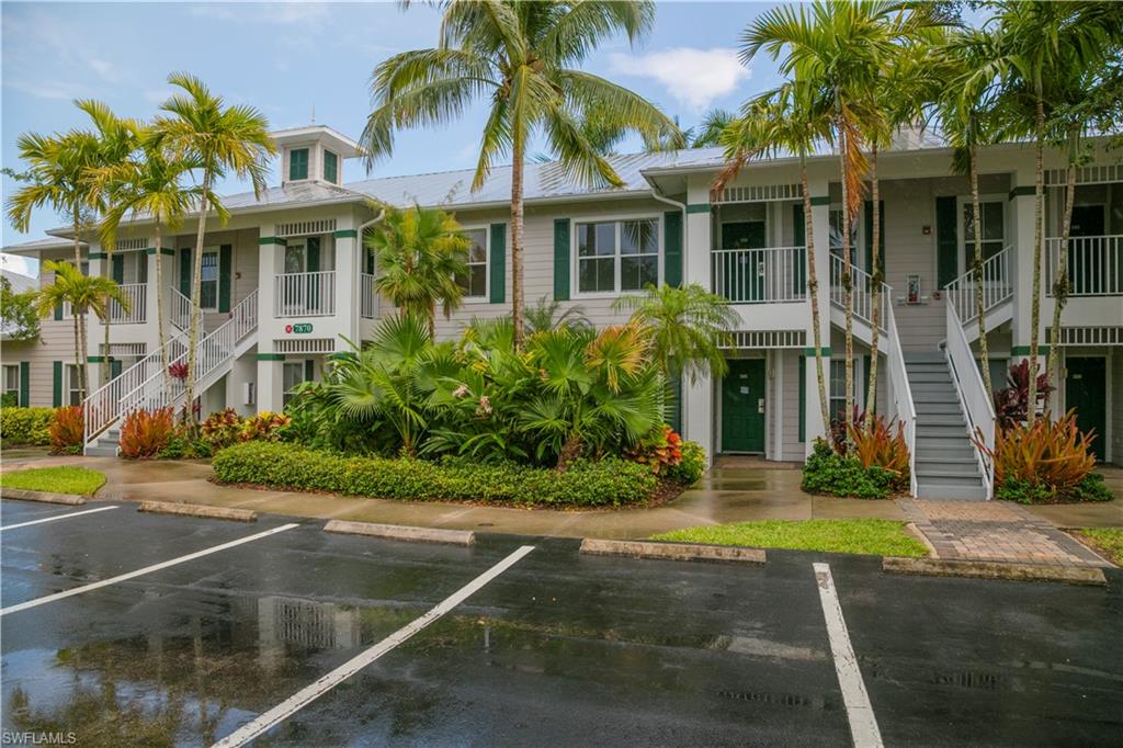 7870 Mahogany Run Lane, Unit 1713 Naples, FL 34113 - Photo 10 of 15 a front view of house with yard and green space
