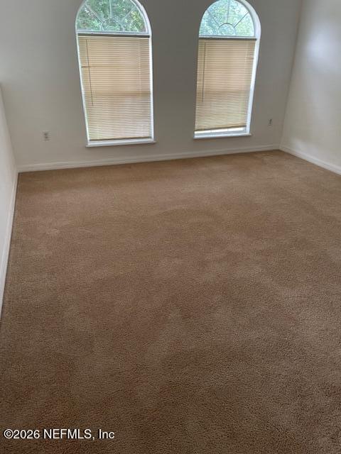 87045 Kipling Drive Yulee, FL 32097 - Photo 11 of 18 an empty room with windows and closet