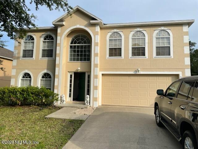 87045 Kipling Drive Yulee, FL 32097 - Photo 16 of 18 a front view of a house with parking
