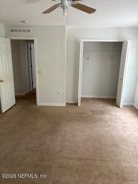 87045 Kipling Drive Yulee, FL 32097 - Photo 17 of 18 an empty room with closet and a chandelier fan
