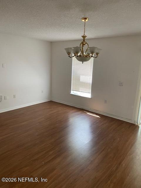 87045 Kipling Drive Yulee, FL 32097 - Photo 3 of 18 an empty room with wooden floor and windows
