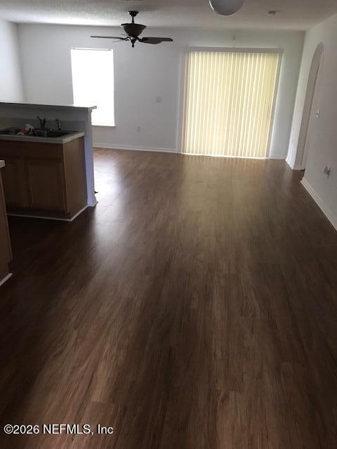 87045 Kipling Drive Yulee, FL 32097 - Photo 10 of 18 an empty room with wooden floor and windows