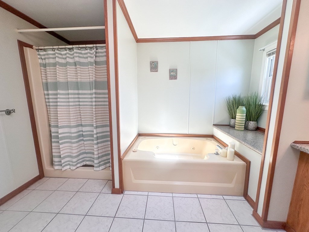 59 Castle Road Attleboro, MA 02703 - Photo 14 of 30 a bathroom with a tub and shower
