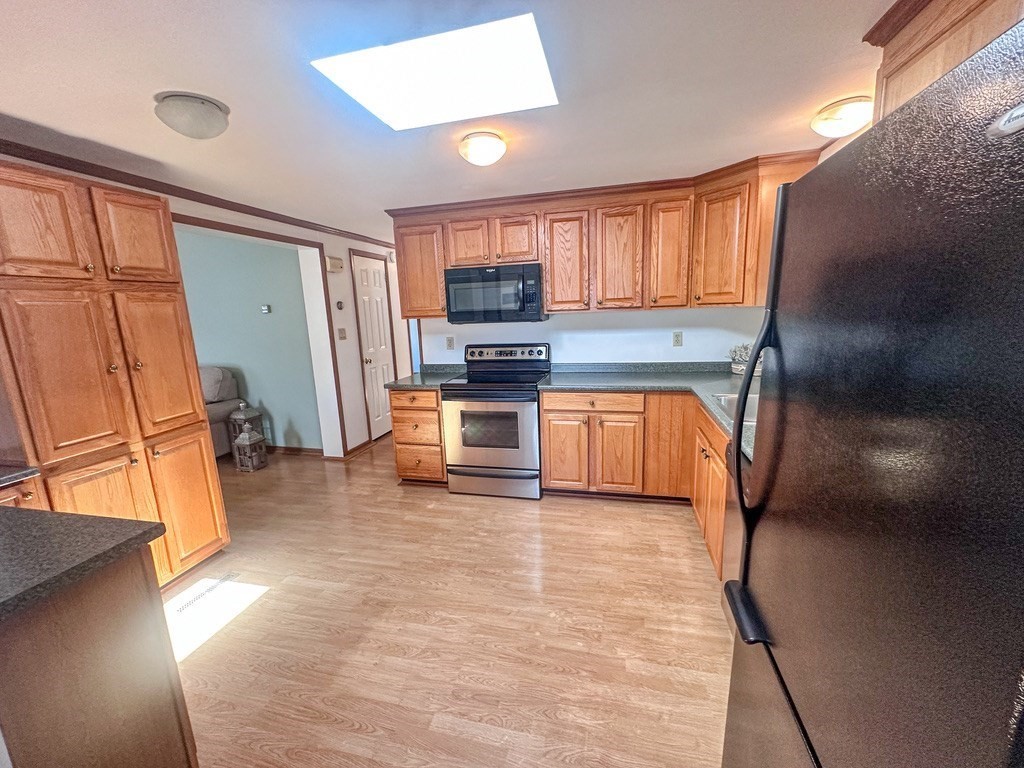 59 Castle Road Attleboro, MA 02703 - Photo 4 of 30 a kitchen with stainless steel appliances granite countertop a refrigerator and a stove top oven