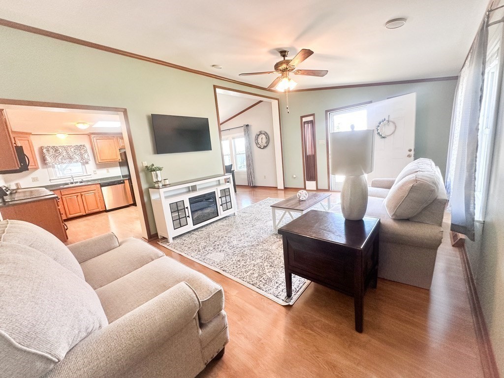 59 Castle Road Attleboro, MA 02703 - Photo 10 of 30 a living room with furniture and a flat screen tv