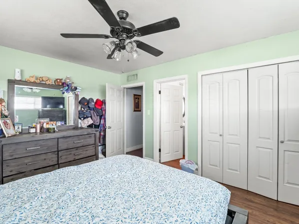 a view of a dining room with furniture a chandelier and wooden floor