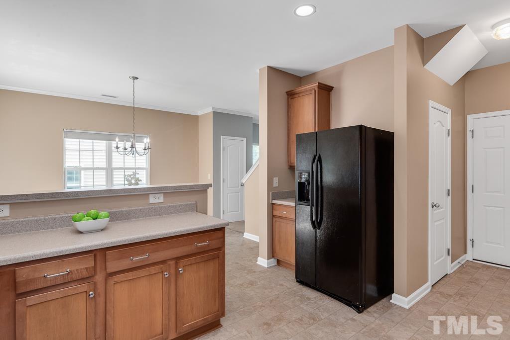 3122 Binghampton Lane Raleigh, NC 27604 - Photo 11 of 28 a kitchen with stainless steel appliances granite countertop a refrigerator and a sink