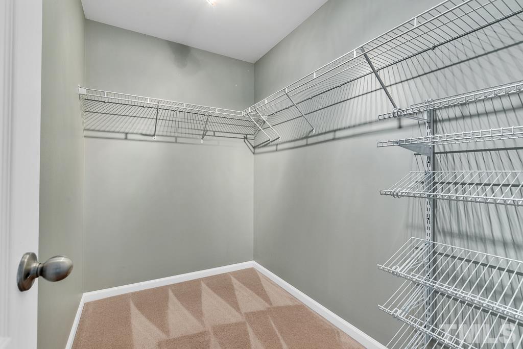 3122 Binghampton Lane Raleigh, NC 27604 - Photo 17 of 28 a view of a room with racks on the wall