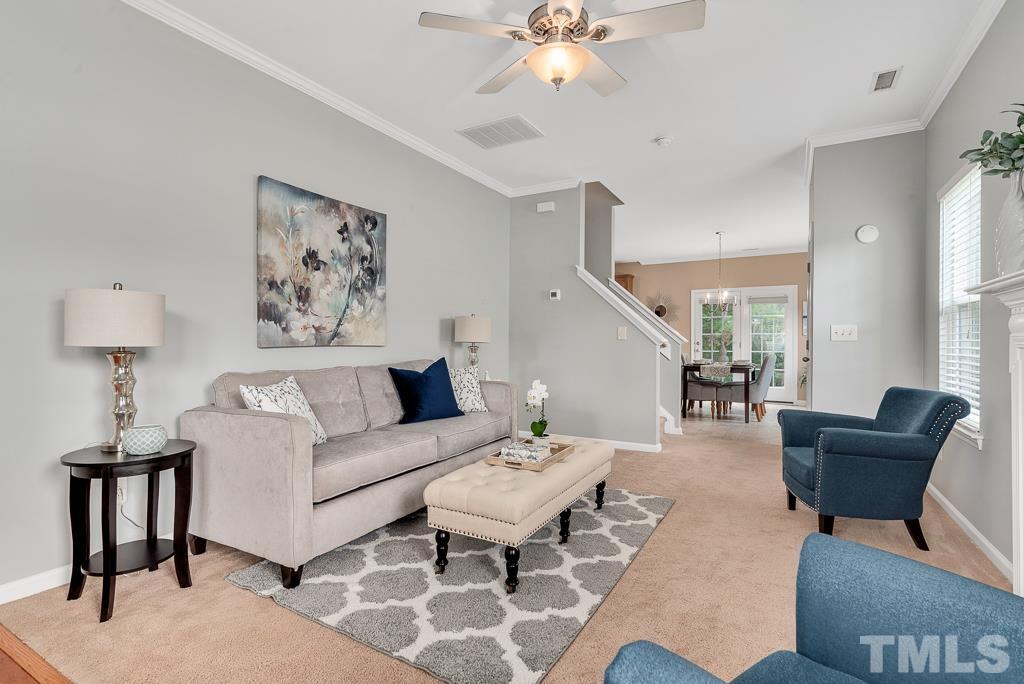 3122 Binghampton Lane Raleigh, NC 27604 - Photo 3 of 28 a living room with furniture and a lamp