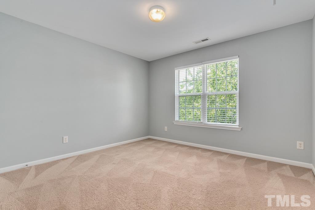3122 Binghampton Lane Raleigh, NC 27604 - Photo 21 of 28 a view of an empty room with a window