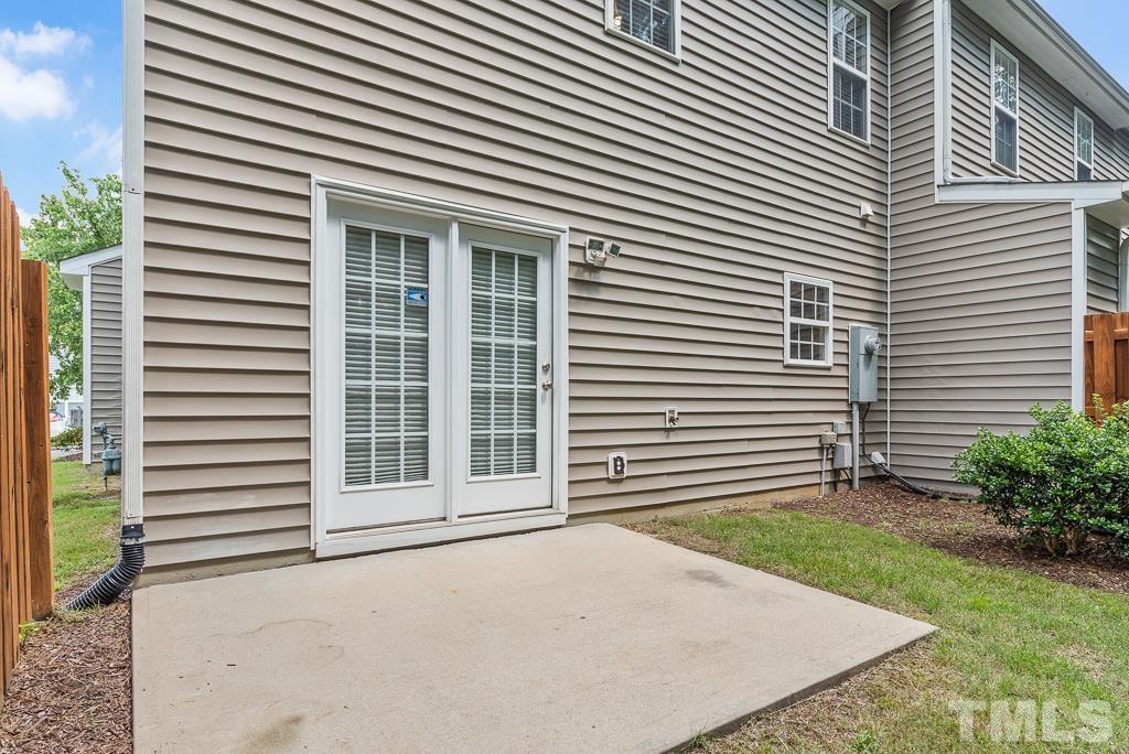 3122 Binghampton Lane Raleigh, NC 27604 - Photo 26 of 28 a view of a house with a yard and garage