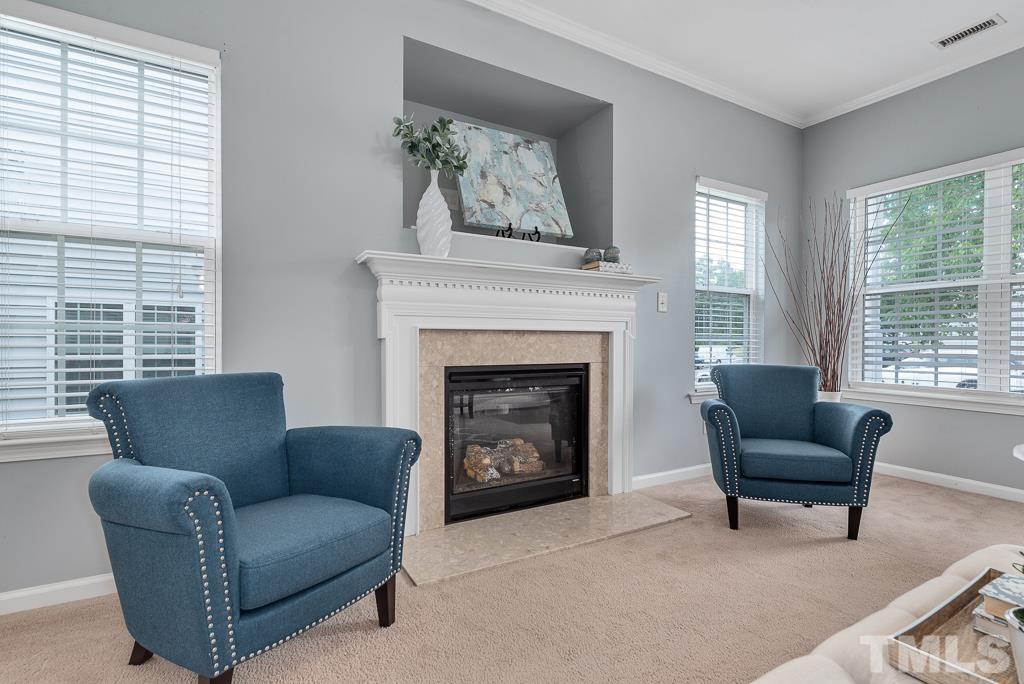 3122 Binghampton Lane Raleigh, NC 27604 - Photo 5 of 28 a living room with furniture and a fireplace