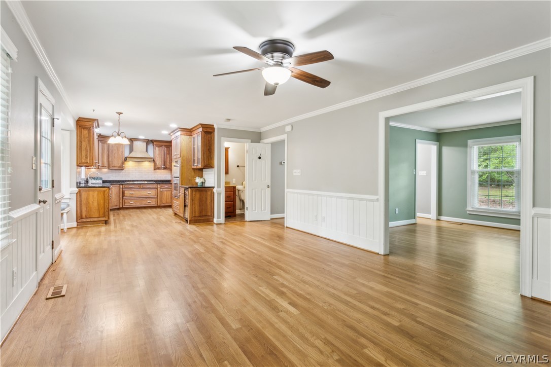 204 Old Cart Road Williamsburg, VA 23188 - Photo 11 of 49 a view of a livingroom with furniture wooden floor a ceiling fan and windows
