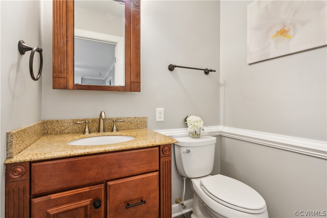 204 Old Cart Road Williamsburg, VA 23188 - Photo 12 of 49 a bathroom with a granite countertop toilet sink mirror and vanity
