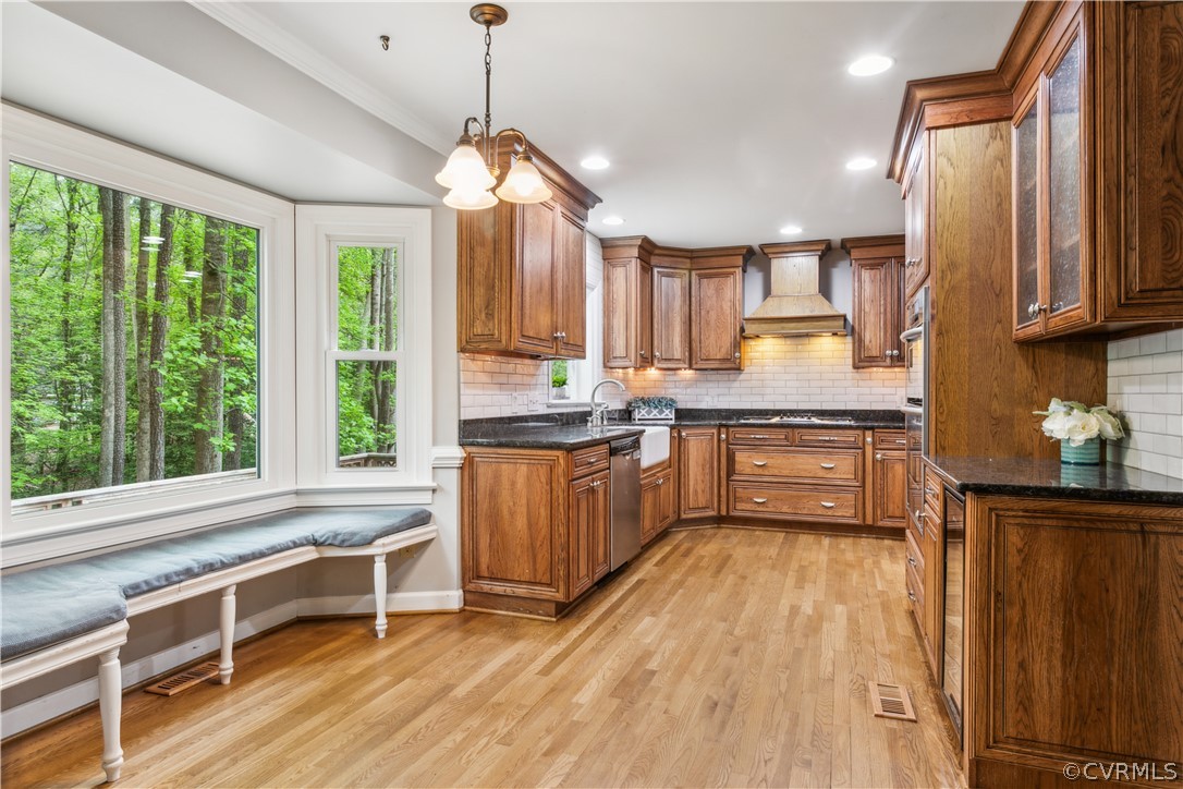 204 Old Cart Road Williamsburg, VA 23188 - Photo 13 of 49 a kitchen with granite countertop a stove a sink a center island and windows