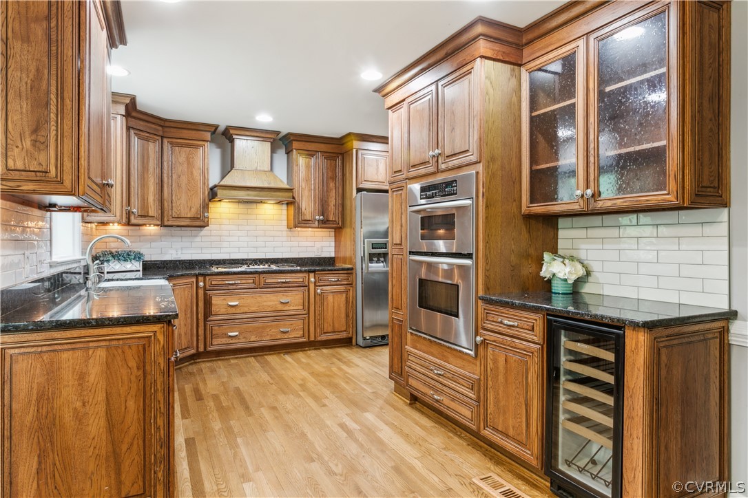 204 Old Cart Road Williamsburg, VA 23188 - Photo 14 of 49 a kitchen with stainless steel appliances a sink and cabinets