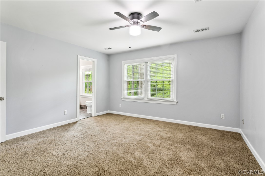 204 Old Cart Road Williamsburg, VA 23188 - Photo 20 of 49 an empty room with windows and ceiling fan