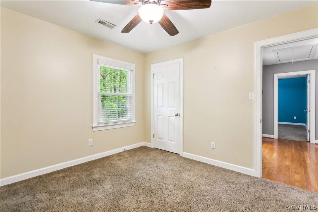 204 Old Cart Road Williamsburg, VA 23188 - Photo 24 of 49 an empty room with windows and fan