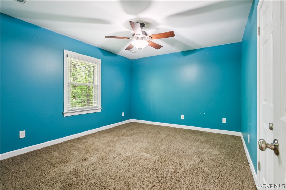 204 Old Cart Road Williamsburg, VA 23188 - Photo 25 of 49 an empty room with windows and fan
