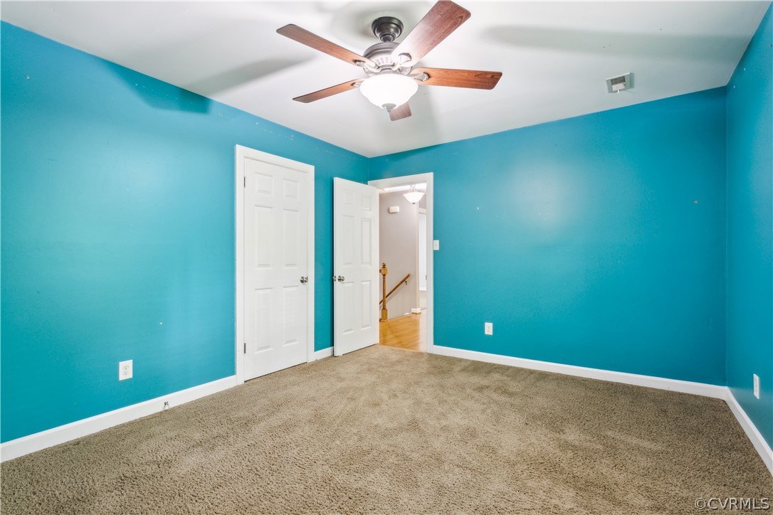 204 Old Cart Road Williamsburg, VA 23188 - Photo 26 of 49 an empty room with closet and fan