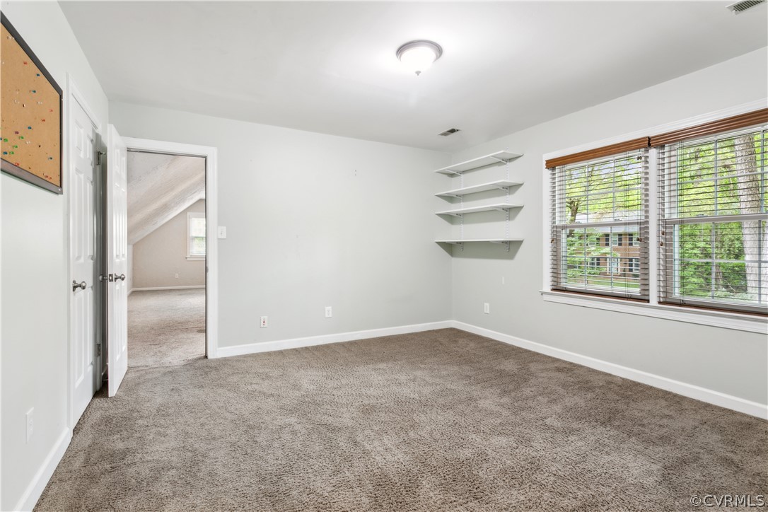 204 Old Cart Road Williamsburg, VA 23188 - Photo 29 of 49 an empty room with a empty space and windows