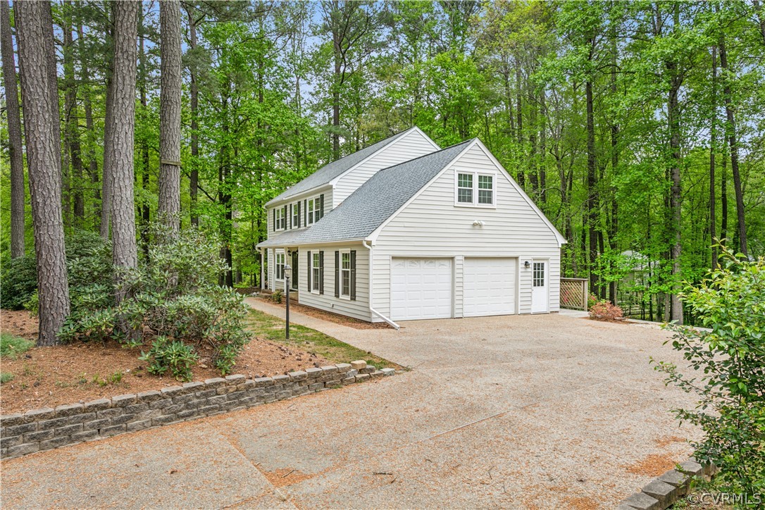 204 Old Cart Road Williamsburg, VA 23188 - Photo 3 of 49 a front view of a house with a garden