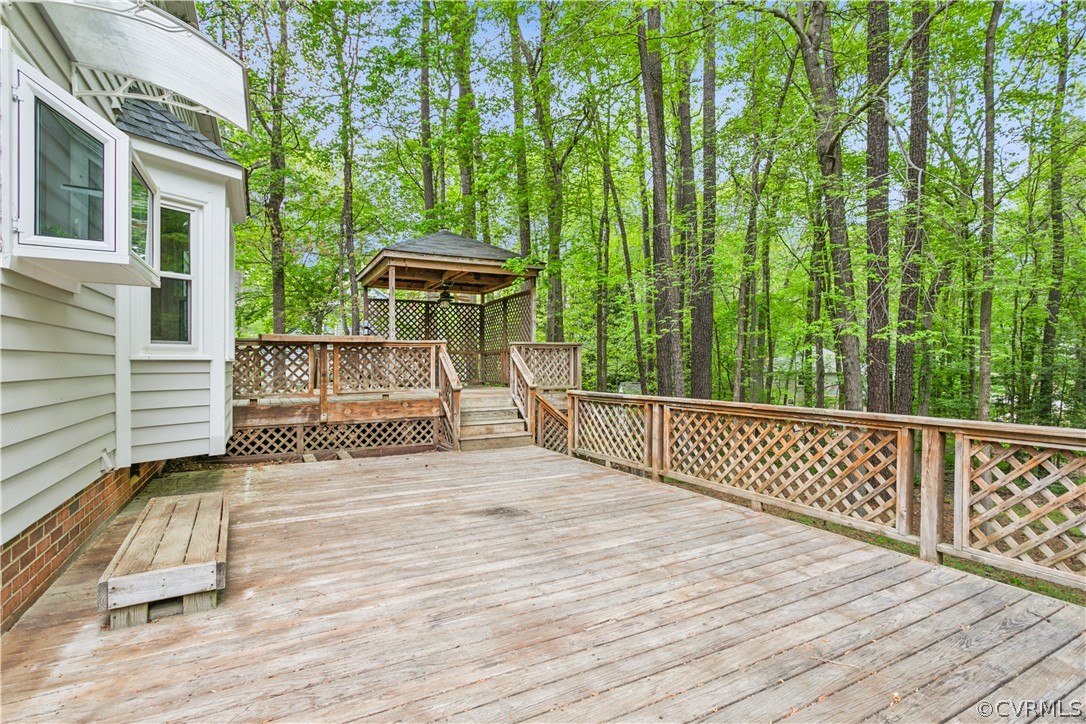 204 Old Cart Road Williamsburg, VA 23188 - Photo 35 of 49 a view of a wooden deck and a yard with fence