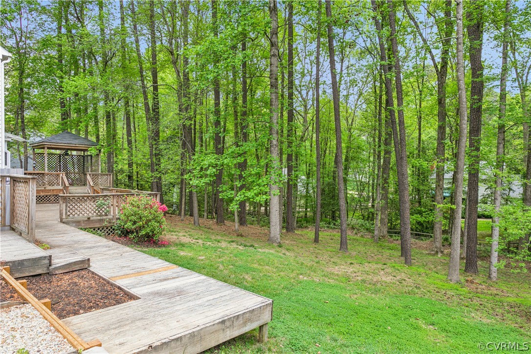 204 Old Cart Road Williamsburg, VA 23188 - Photo 39 of 49 a view of a backyard with plants and garden
