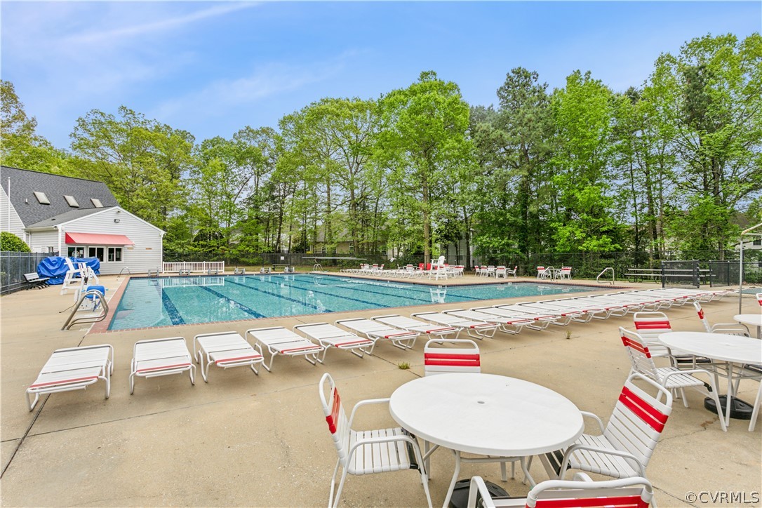 204 Old Cart Road Williamsburg, VA 23188 - Photo 44 of 49 a backyard of a house with table and chairs