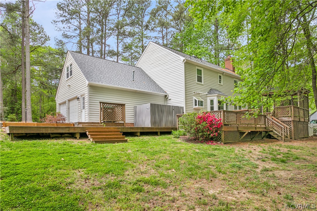204 Old Cart Road Williamsburg, VA 23188 - Photo 5 of 49 a view of a house with a yard and sitting area