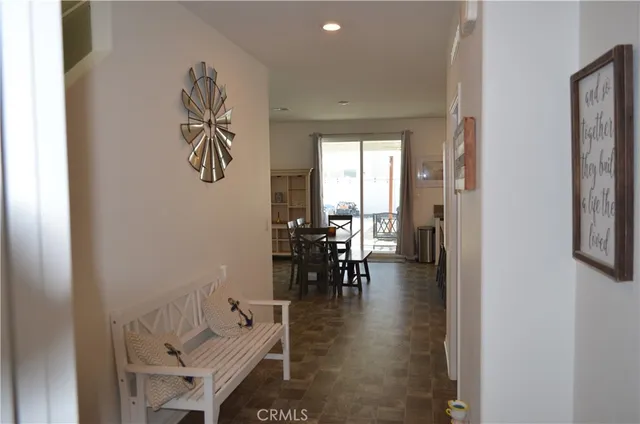 wooden floor with a table and chairs