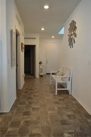 a view of a hallway with seating area