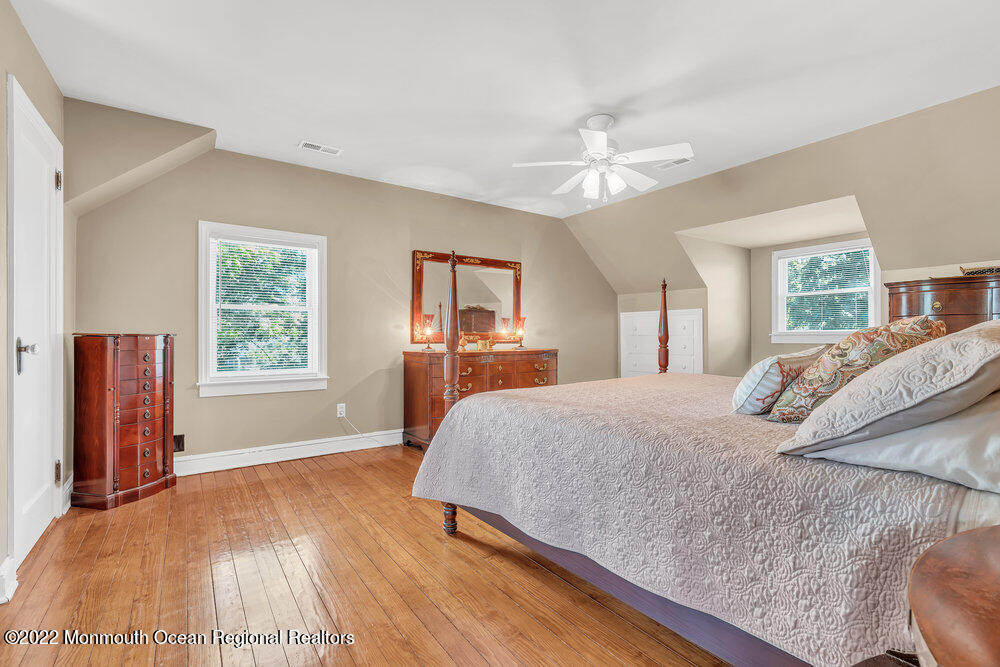 30 Brand Road Toms River, NJ 08753 - Photo 42 of 54 a bedroom with a large bed and a chandelier