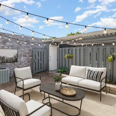 a view of a patio with couches and a table