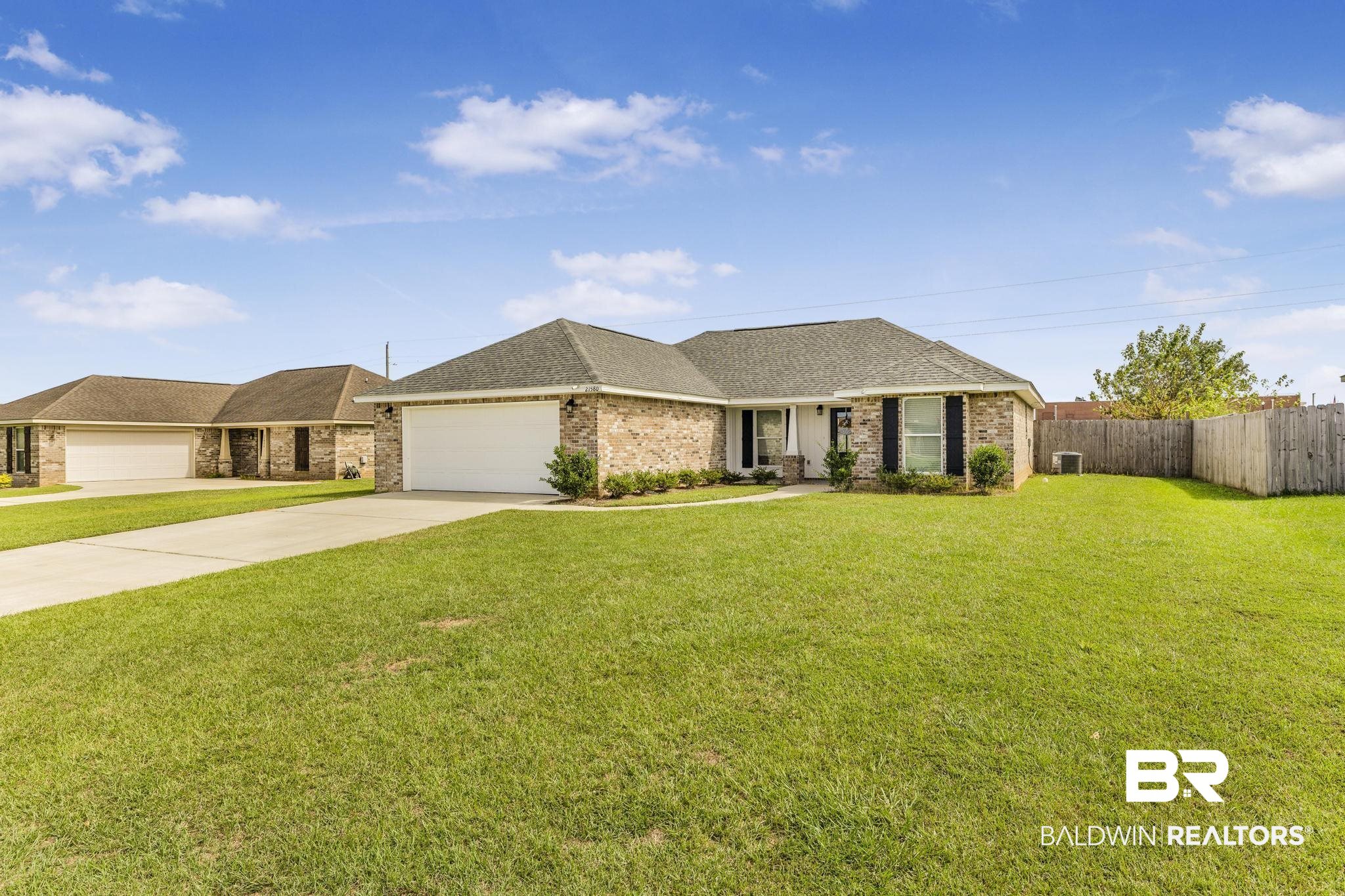 21580 Talbot Lane Robertsdale, AL 36567 - Photo 2 of 25 Ranch-style house with driveway, a shingled roof, an attached garage, and brick siding