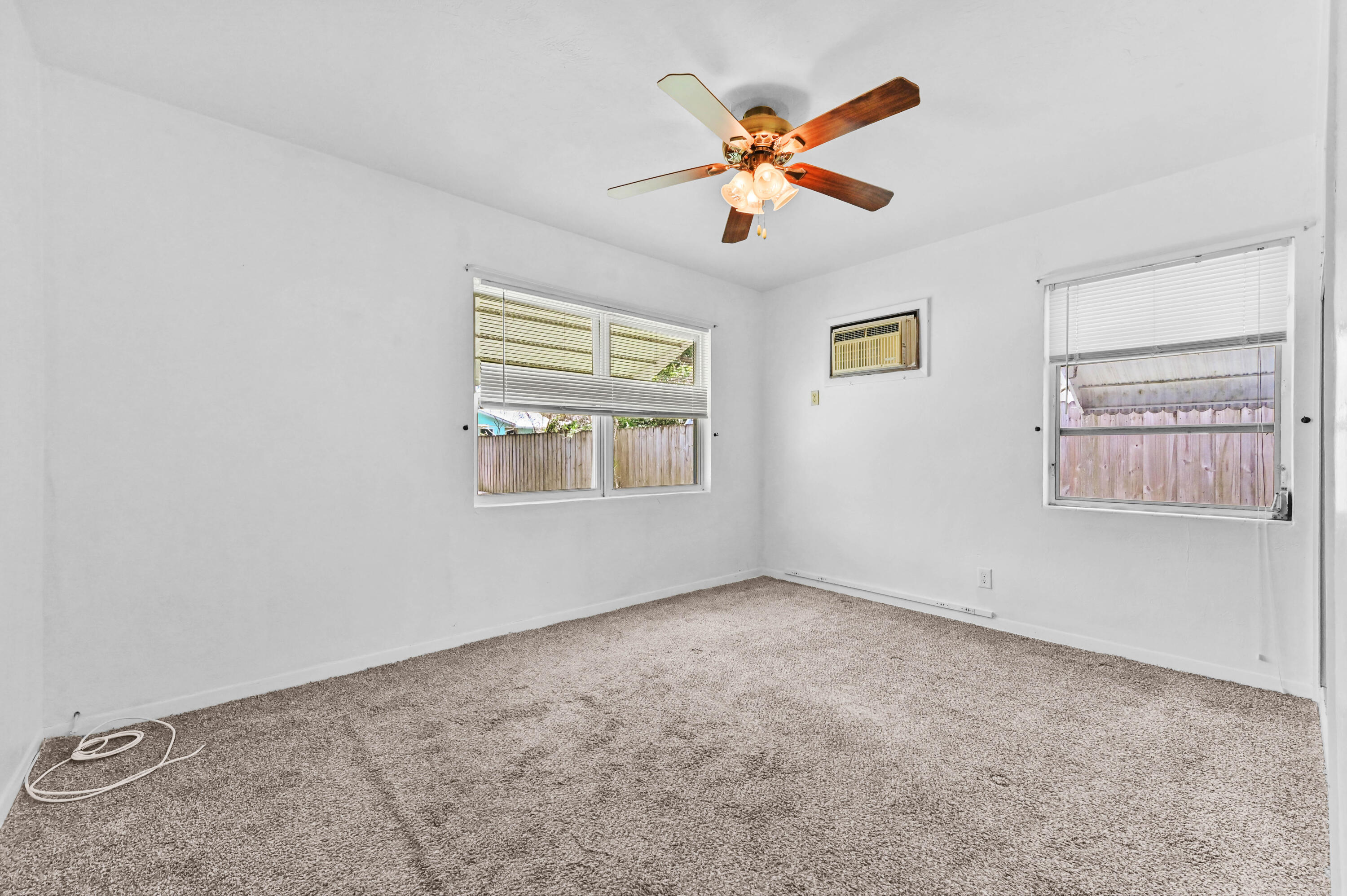 5709 Southeast Indigo Avenue Stuart, FL 34997 - Photo 17 of 26 a view of an empty room with a window