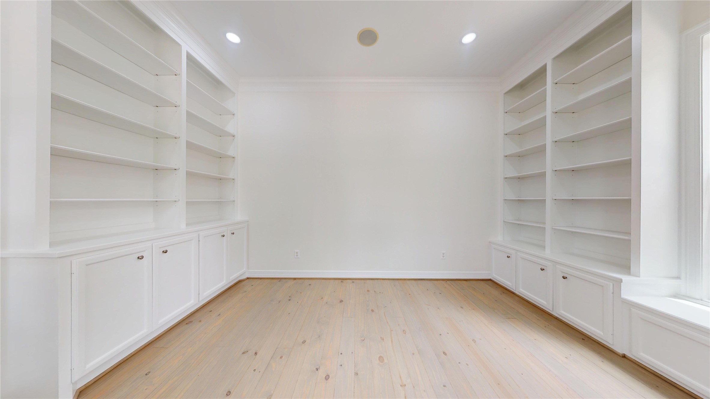 4050 Dumbarton Street Houston, TX 77025 - Photo 22 of 48 Office/Study/ Living Room located on the first floor. Beautiful built-ins, refinished Pinewood Flooring and updated lighting.