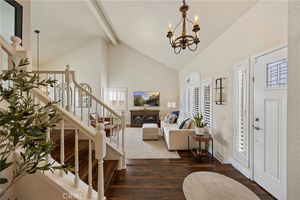 7051 Stanislaus Place Rancho Cucamonga, CA 91701 - Photo 12 of 57 a living room with furniture windows and a chandelier