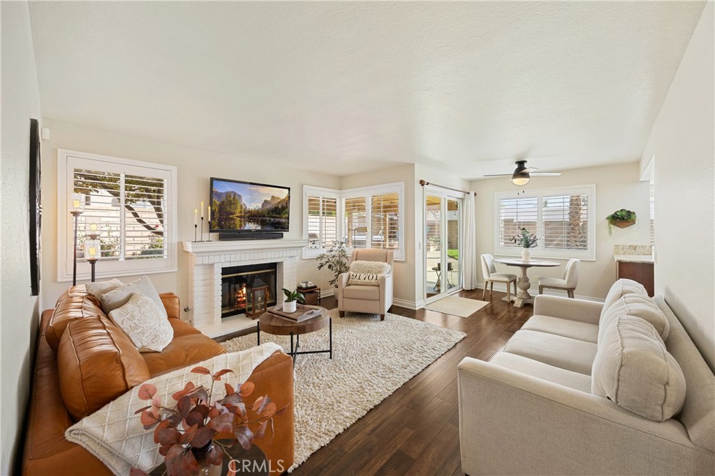 7051 Stanislaus Place Rancho Cucamonga, CA 91701 - Photo 13 of 57 a living room with furniture and a fireplace